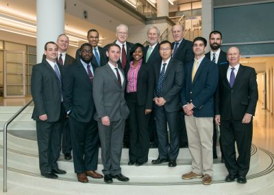Students in suits pose for a photo with Freeman Hrabowski, Bruce Jarrell, and Don Boesch