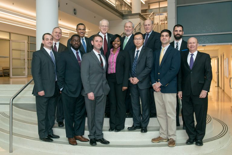 Students in suits pose for a photo with Freeman Hrabowski, Bruce Jarrell, and Don Boesch