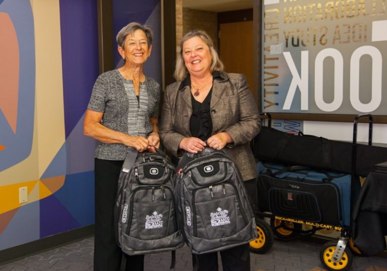 Carole Ratcliffe and Tina with backpacks at AACC Pitch Competition